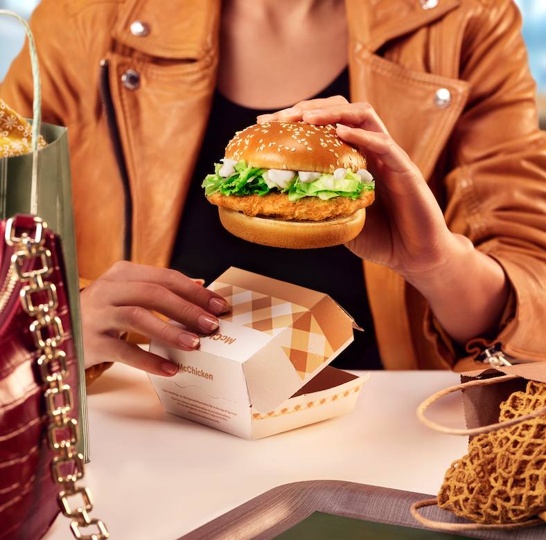 Person eating a Mc Chicken for a Mc Donalds food styling photoshoot by Sander de Ponti and No Points Studio's